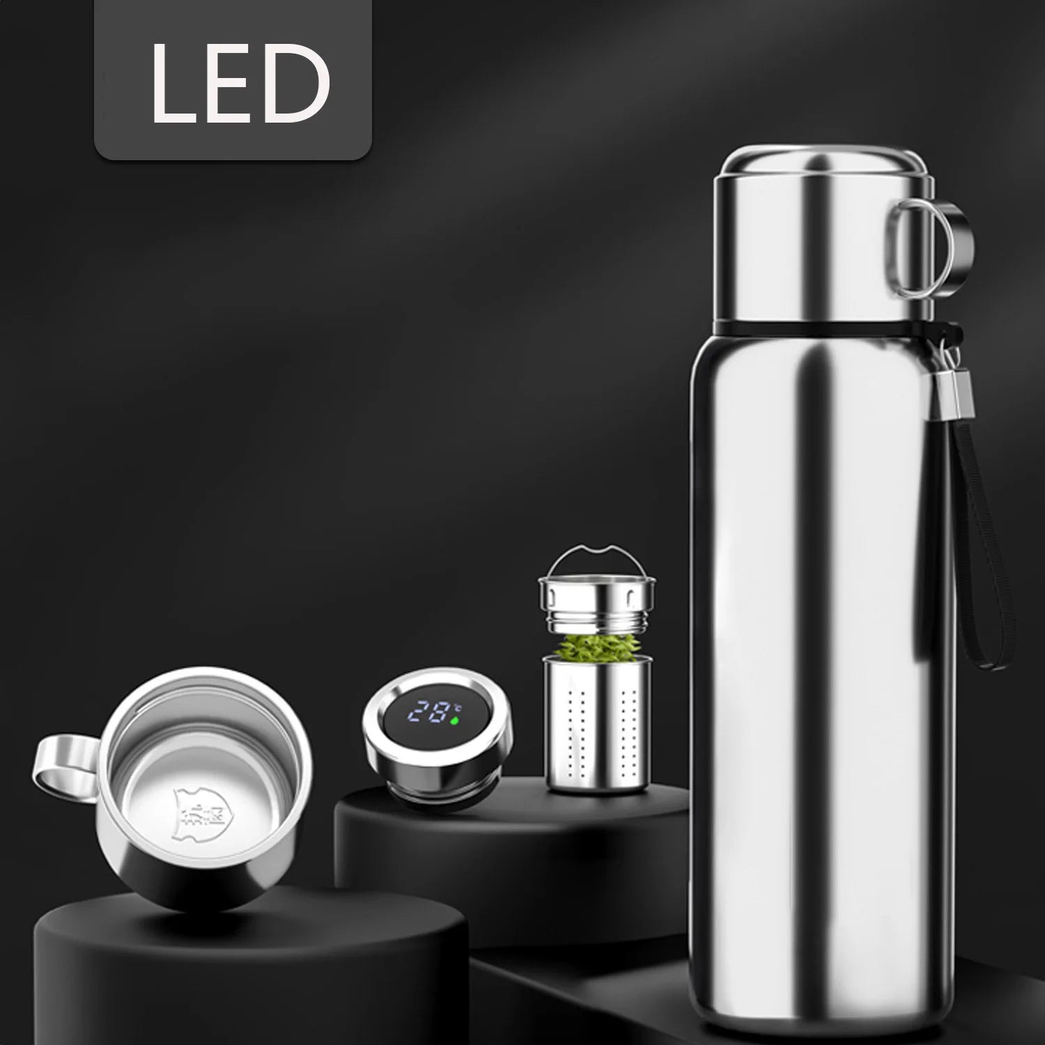 Silver stainless steel smart thermos with LED temperature lid, tea infuser, and matching cup on black background. BeTrendy